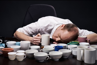 man head on desk empty cups.jpg